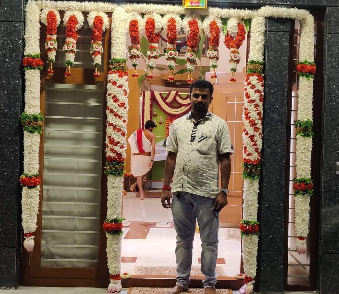 Elaborate White & Orange Floral Doorway Arch with Hanging Tassels